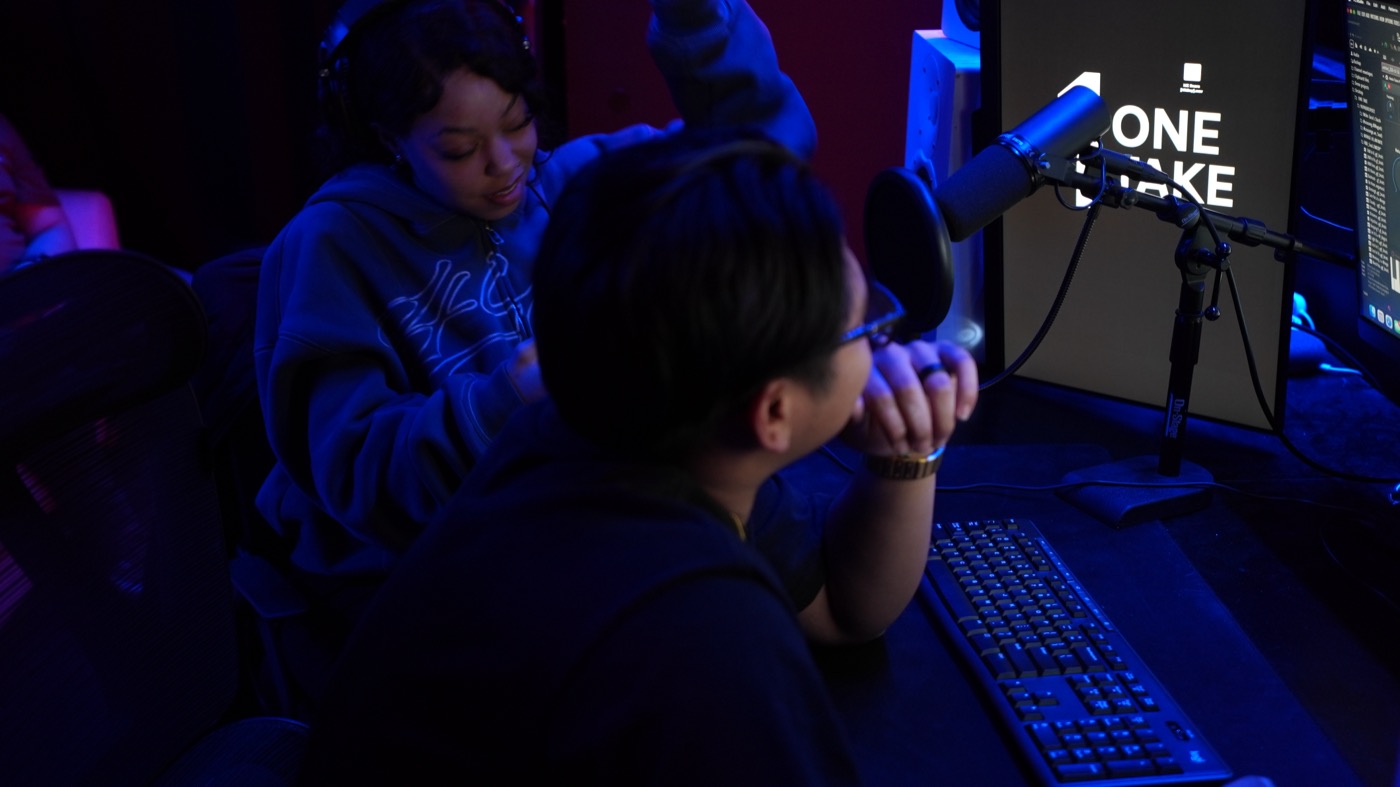 Engineer and artist working through a session at the desk
