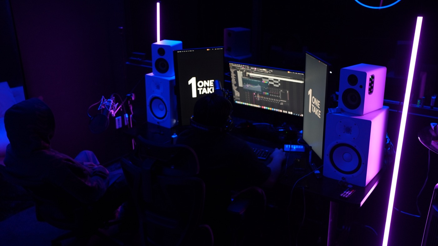 The mixing desk lit in purple and blue during a session
