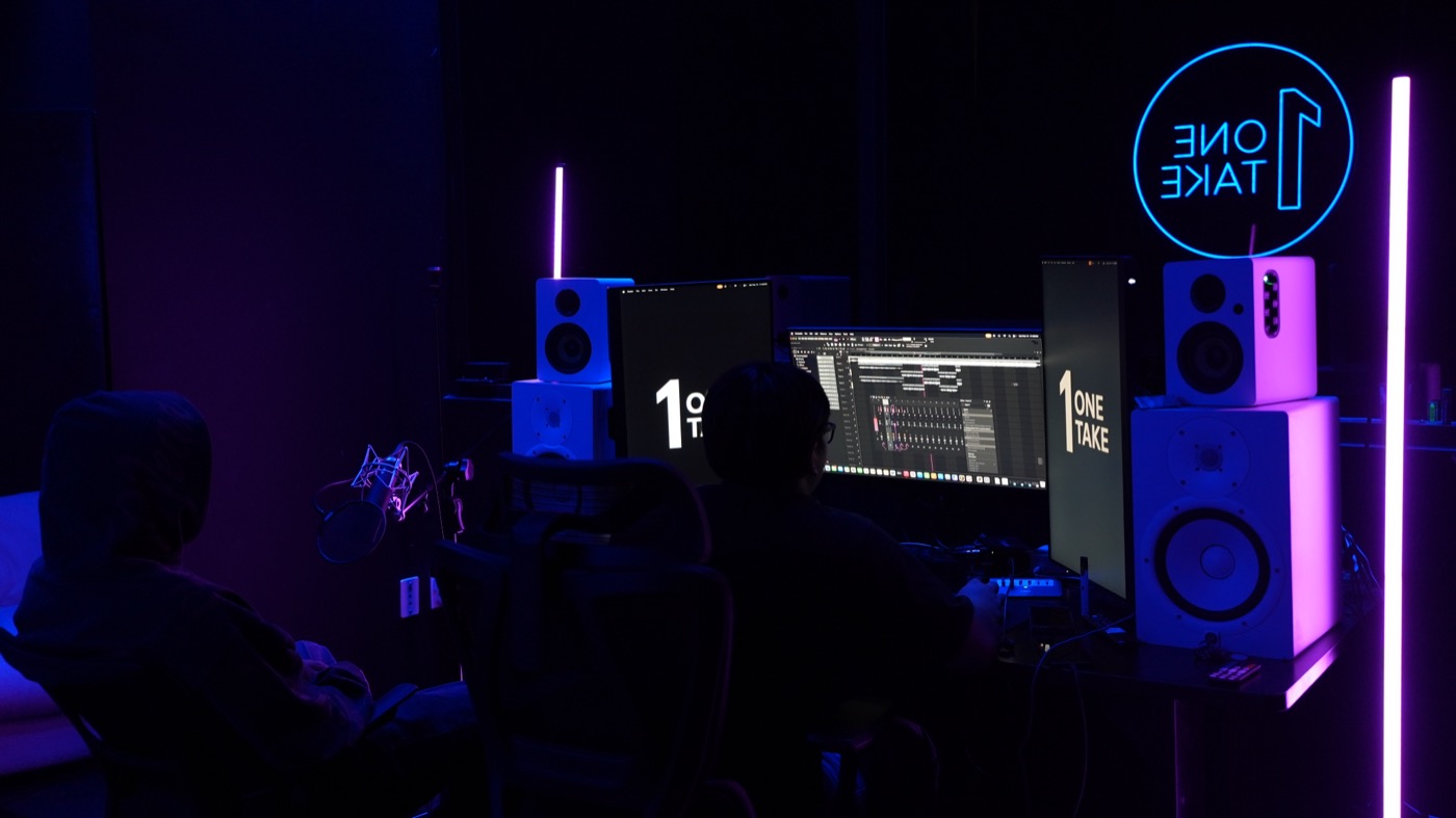 Wide view of the mixing desk, monitors and studio speakers